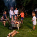 Children cooking Smores over LUX Pro Precision grill with Versa Grate rotated away from fire.