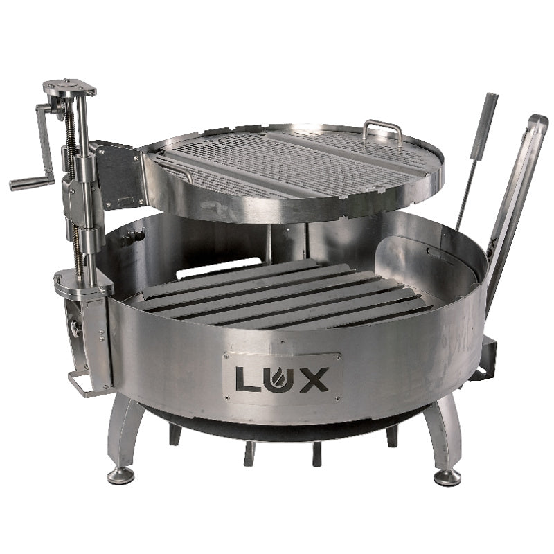 View of Pro Precision grill with Lux logo on front. Versa Grate centered over grill. Tools in holder.